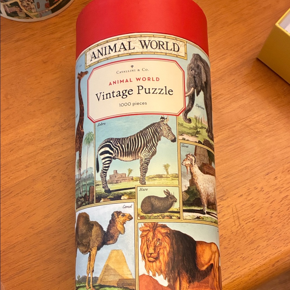 Cavallini & Co. Animal World Vintage Puzzle - Red Cylinder Packaging